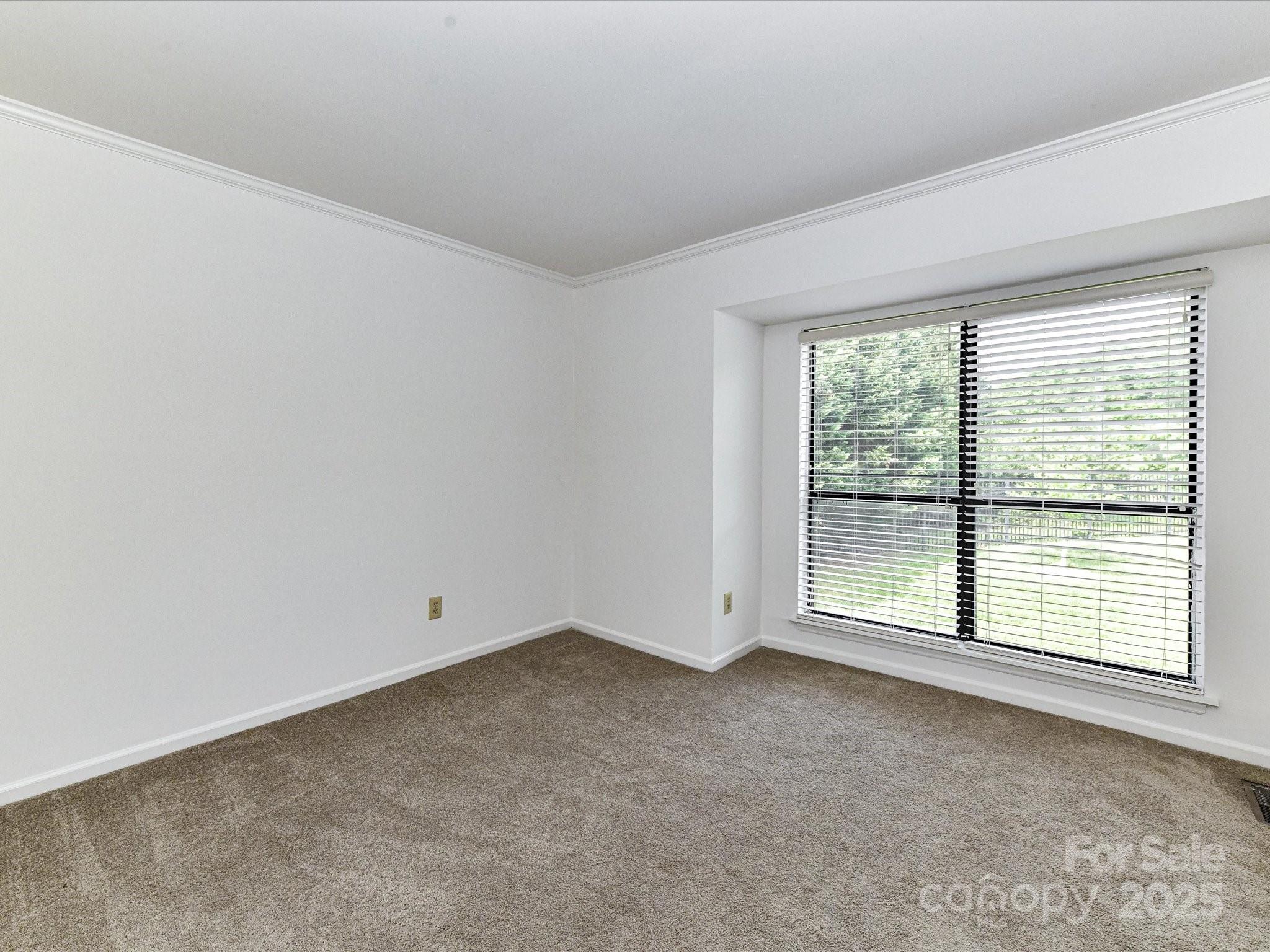 11020 Carmel Crossing Road Charlotte, NC 28226 - Photo 25 of 30 an empty room with a window