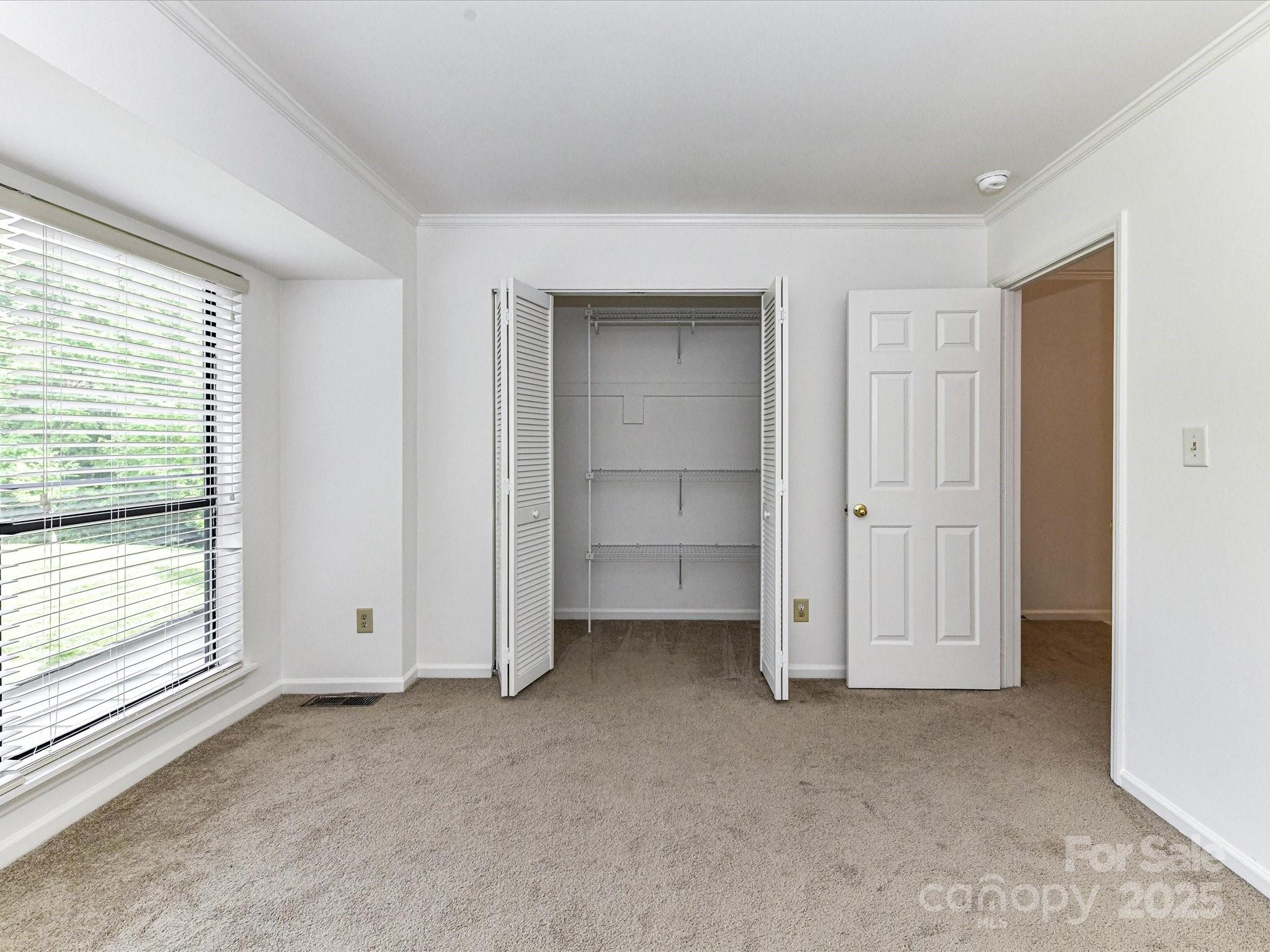 11020 Carmel Crossing Road Charlotte, NC 28226 - Photo 26 of 30 a view of an empty room with a window