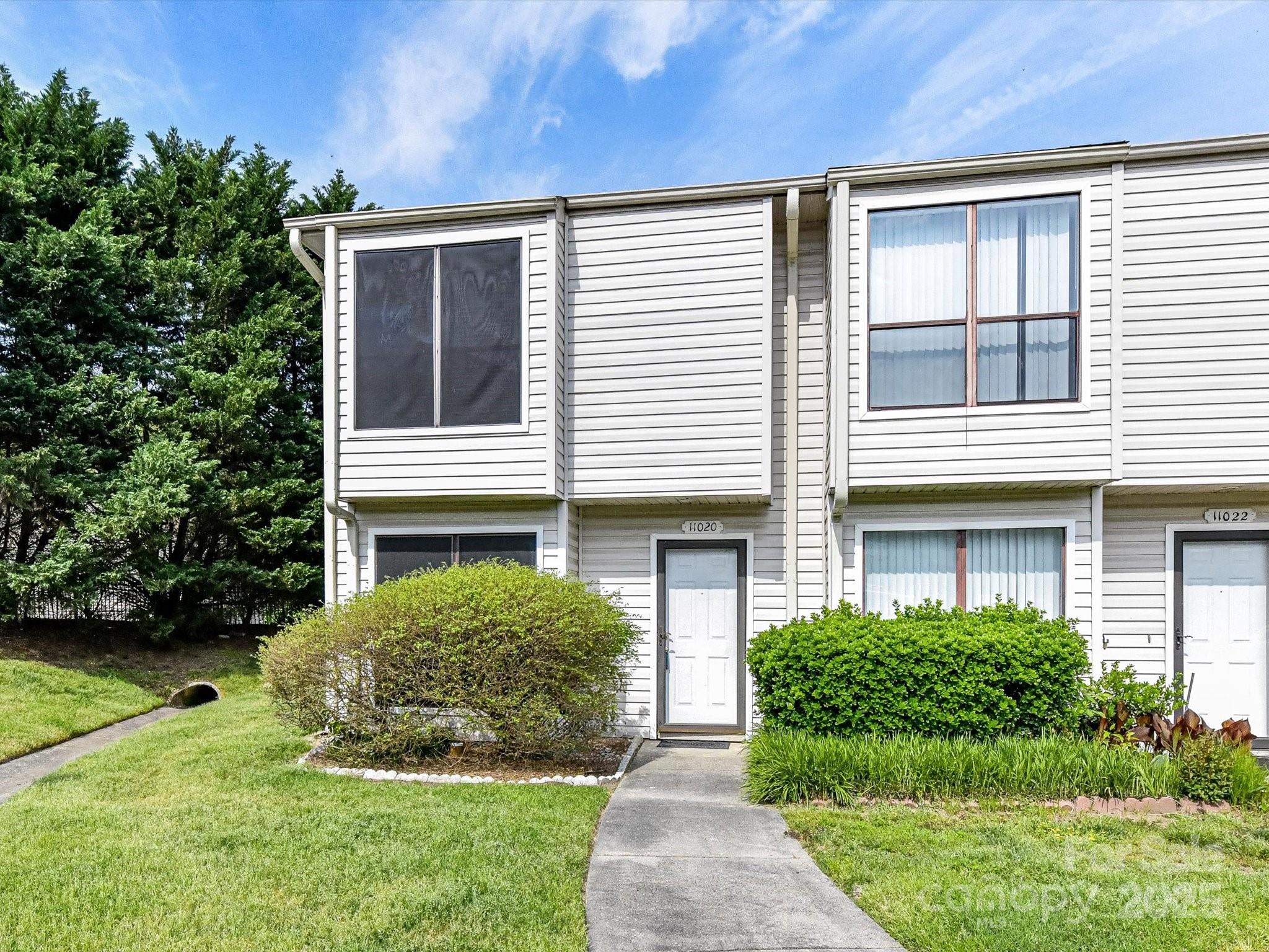 11020 Carmel Crossing Road Charlotte, NC 28226 - Photo 3 of 30 a house view with a garden space