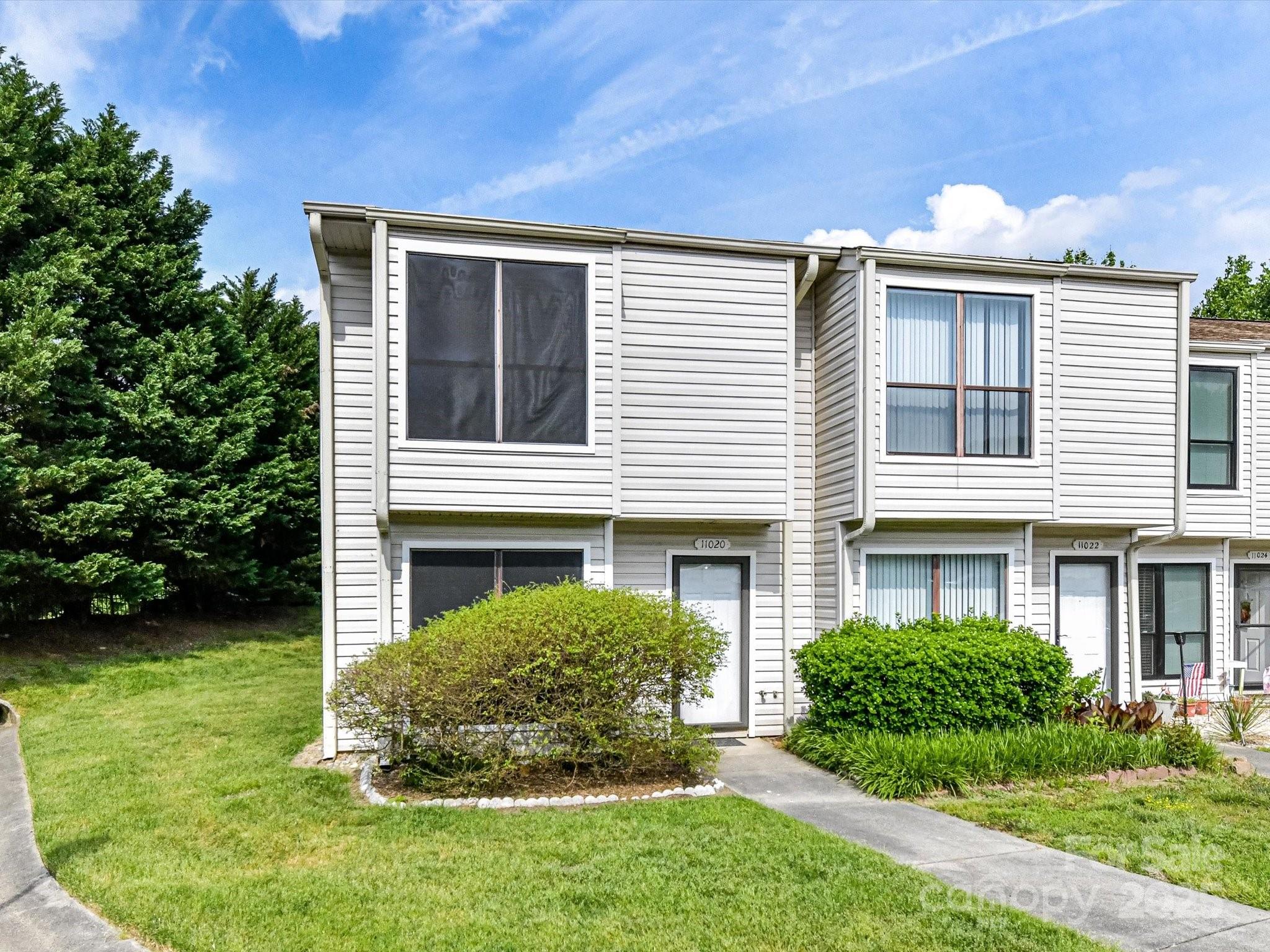 11020 Carmel Crossing Road Charlotte, NC 28226 - Photo 4 of 30 a view of a house with a yard