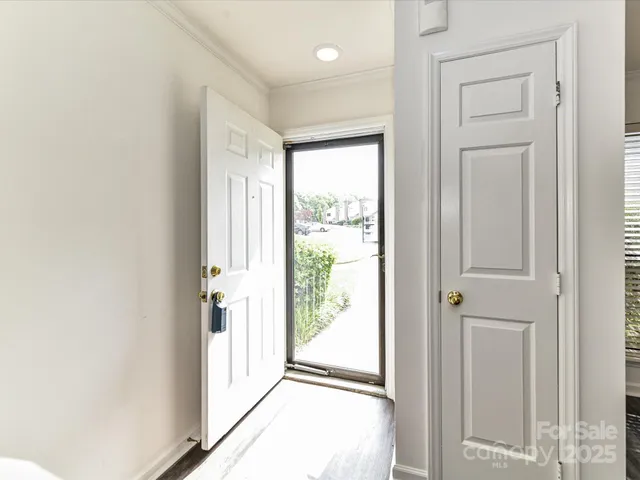 a view of a hallway with a outdoor space