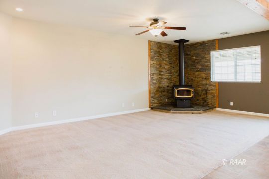 1633 South Farragut Street Ridgecrest, CA 93555 - Photo 10 of 30 a view of a livingroom with a fireplace