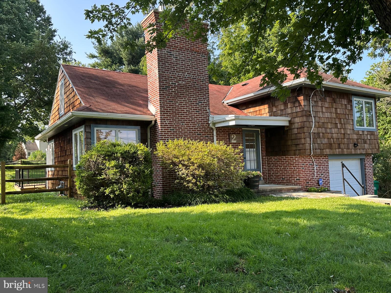2 Snuff Mill Road Wilmington, DE 19807 - Photo 2 of 16 Charming brick home with lush greenery.