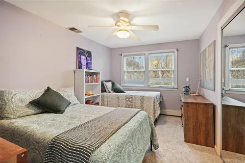 a bathroom with a shower and a sink