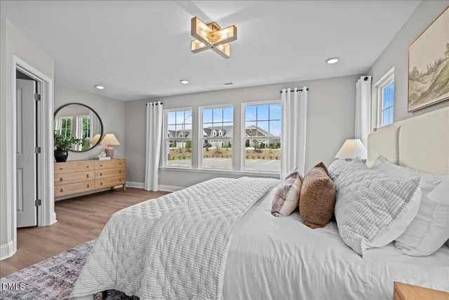 a bedroom with a large bed and a window