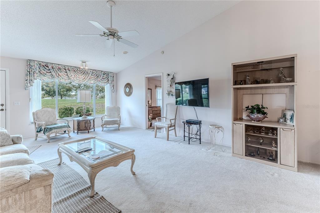 2420 Rolling View Drive Spring Hill, FL 34606 - Photo 13 of 62 a living room with furniture and a window