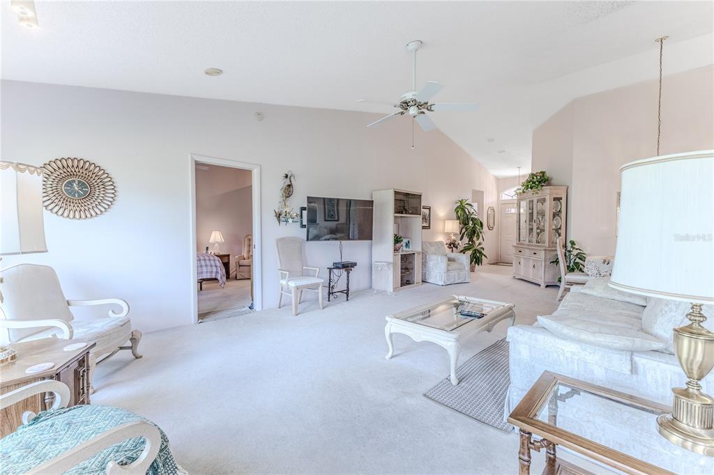 2420 Rolling View Drive Spring Hill, FL 34606 - Photo 17 of 62 a living room with furniture and a table