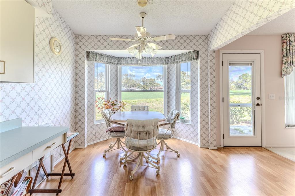 2420 Rolling View Drive Spring Hill, FL 34606 - Photo 20 of 62 a view of a dining room with furniture window and wooden floor