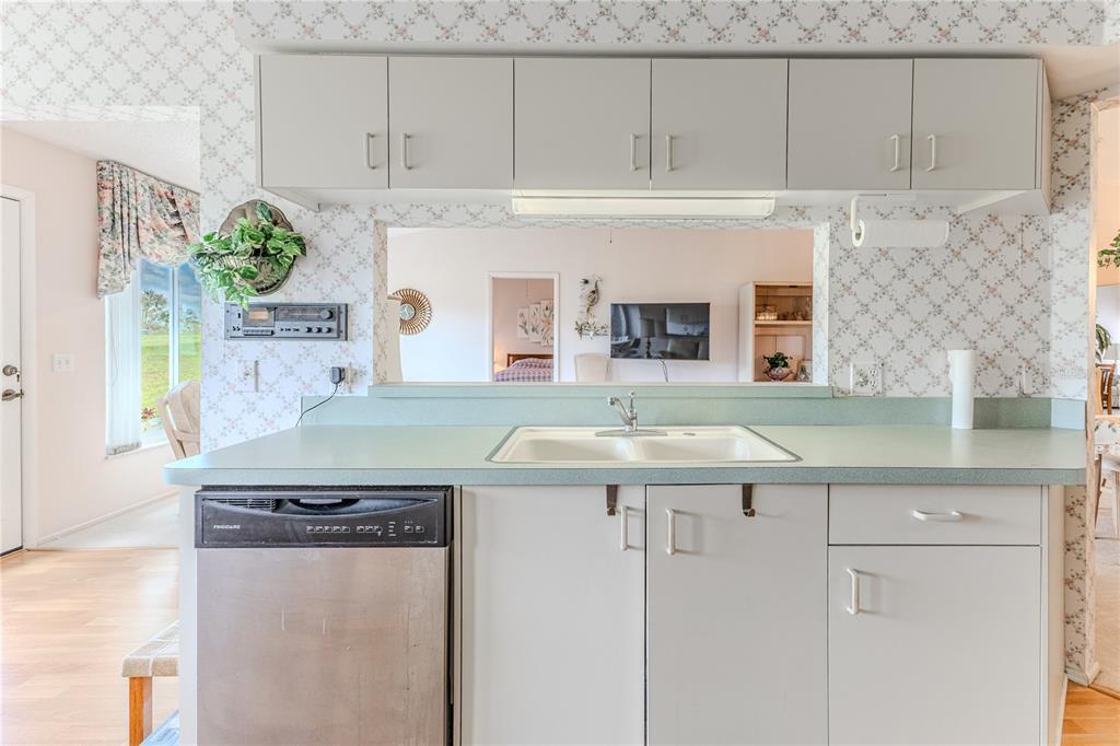 2420 Rolling View Drive Spring Hill, FL 34606 - Photo 22 of 62 a kitchen with a sink and cabinets
