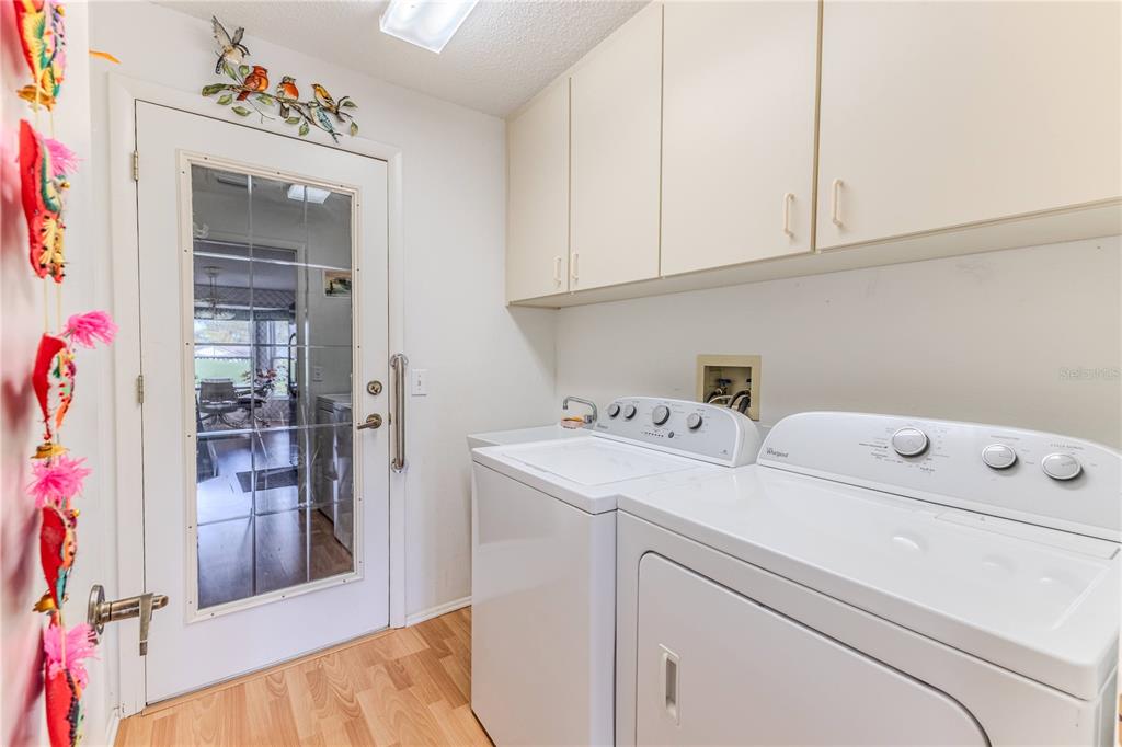 2420 Rolling View Drive Spring Hill, FL 34606 - Photo 23 of 62 a utility room with dryer and washer