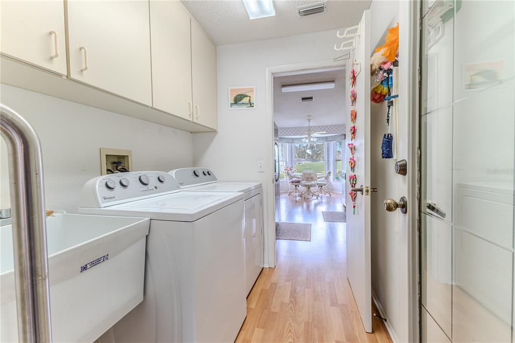 2420 Rolling View Drive Spring Hill, FL 34606 - Photo 27 of 62 a utility room with dryer and washer