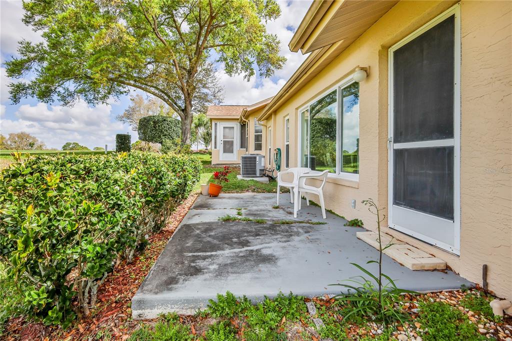 2420 Rolling View Drive Spring Hill, FL 34606 - Photo 30 of 62 a view of a house with backyard and sitting area