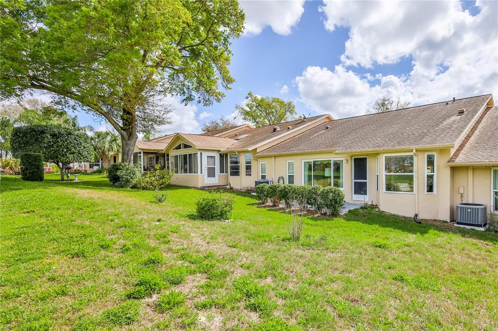2420 Rolling View Drive Spring Hill, FL 34606 - Photo 31 of 62 a front view of a house with porch and garden