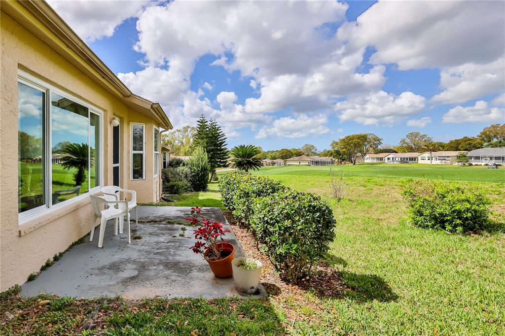 2420 Rolling View Drive Spring Hill, FL 34606 - Photo 35 of 62 a view of a garden with lounge chair