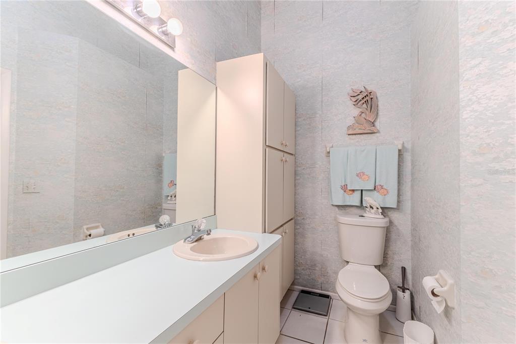 2420 Rolling View Drive Spring Hill, FL 34606 - Photo 42 of 62 a bathroom with a sink toilet and shower