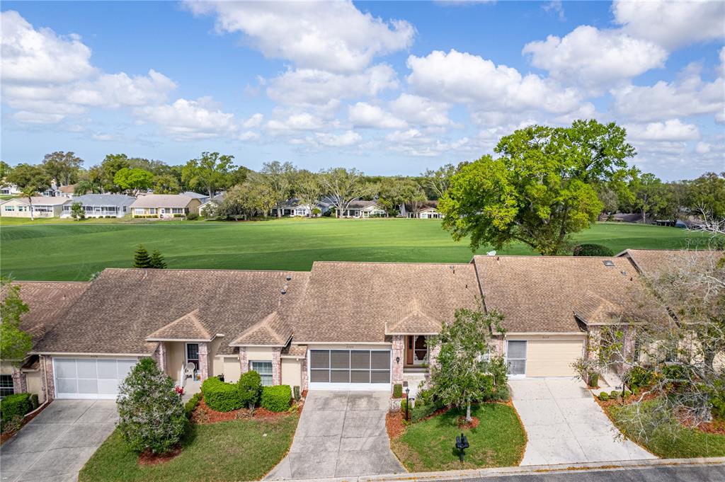 2420 Rolling View Drive Spring Hill, FL 34606 - Photo 43 of 62 an aerial view of a house with a yard and a garden