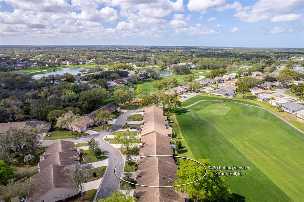2420 Rolling View Drive Spring Hill, FL 34606 - Photo 48 of 62 an aerial view of residential houses with outdoor space and trees