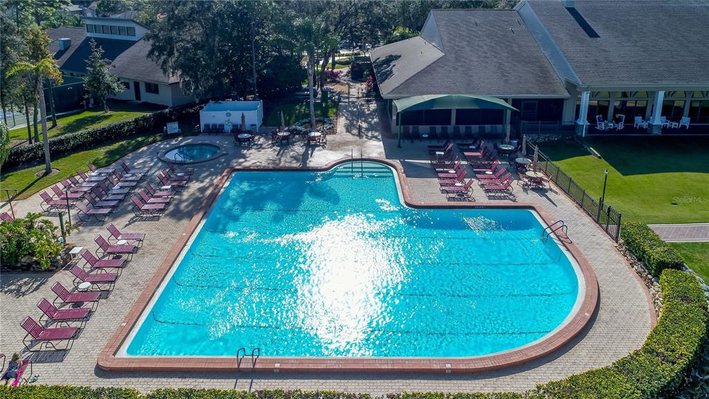 2420 Rolling View Drive Spring Hill, FL 34606 - Photo 56 of 62 a view of a swimming pool with sitting area