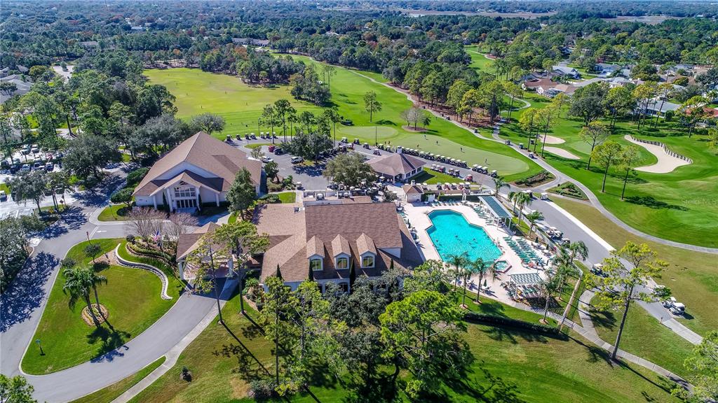 2420 Rolling View Drive Spring Hill, FL 34606 - Photo 62 of 62 an aerial view of a house with a garden and a lake view