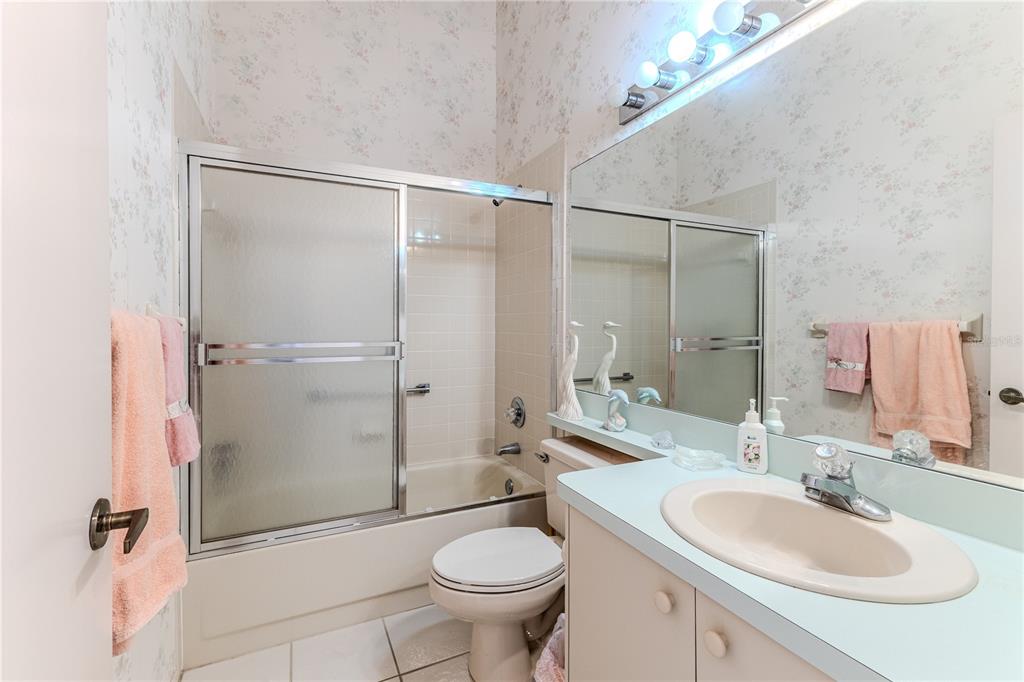 2420 Rolling View Drive Spring Hill, FL 34606 - Photo 9 of 62 a bathroom with a sink toilet and shower