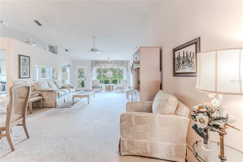 2420 Rolling View Drive Spring Hill, FL 34606 - Photo 10 of 62 a living room with furniture and wooden floor