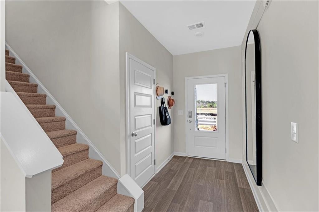 117 Lavender Circle Calhoun, GA 30701 - Photo 15 of 29 a view of a hallway with wooden floor and entryway
