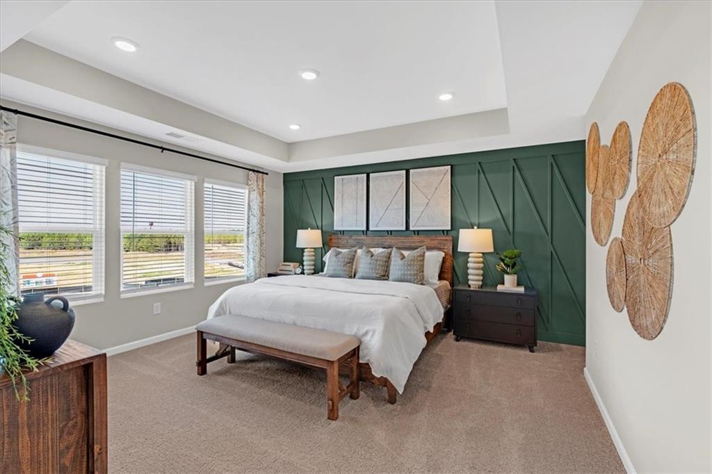 117 Lavender Circle Calhoun, GA 30701 - Photo 17 of 29 a spacious bedroom with a bed and a large window