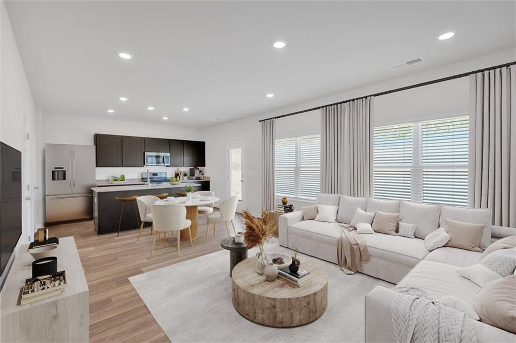 117 Lavender Circle Calhoun, GA 30701 - Photo 2 of 29 a living room with furniture kitchen and a table