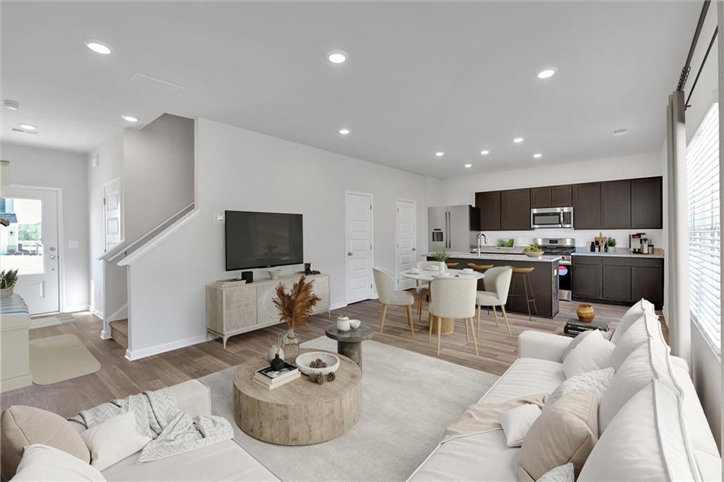 117 Lavender Circle Calhoun, GA 30701 - Photo 3 of 29 a living room with furniture kitchen view and a flat screen tv