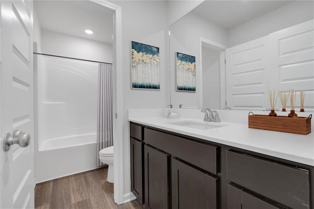 117 Lavender Circle Calhoun, GA 30701 - Photo 6 of 29 a bathroom with a sink and a mirror