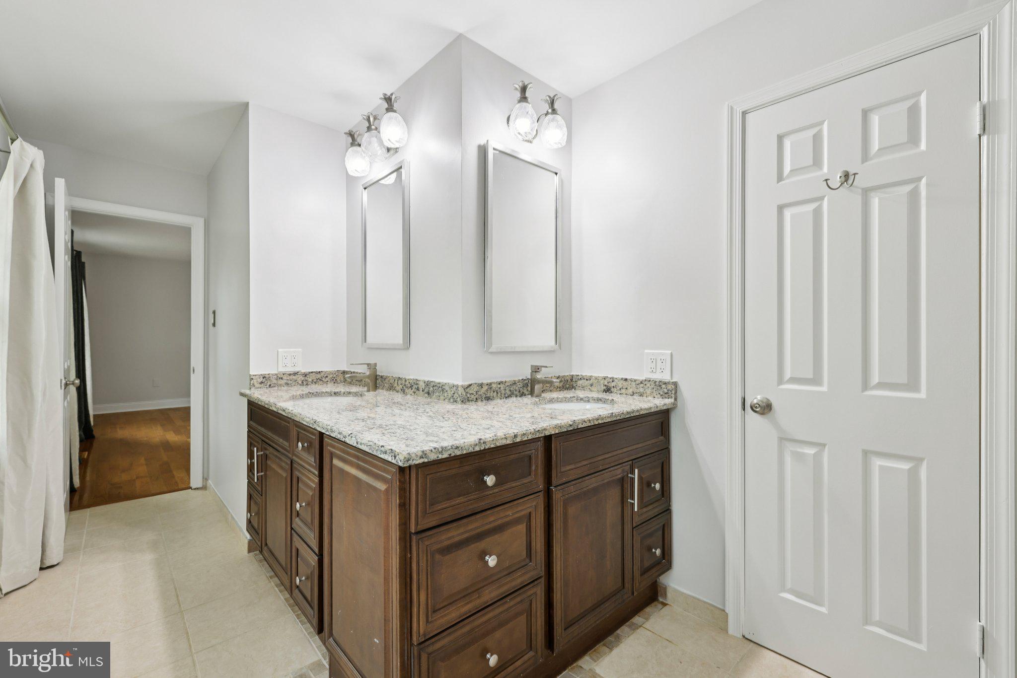 10700 Game Preserve Road Gaithersburg, MD 20879 - Photo 31 of 63 Elegant Owner's dual-sink bathroom retreat.
