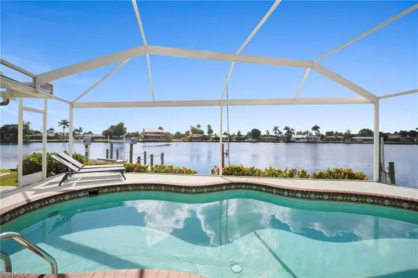 a view of a swimming pool with a lake view