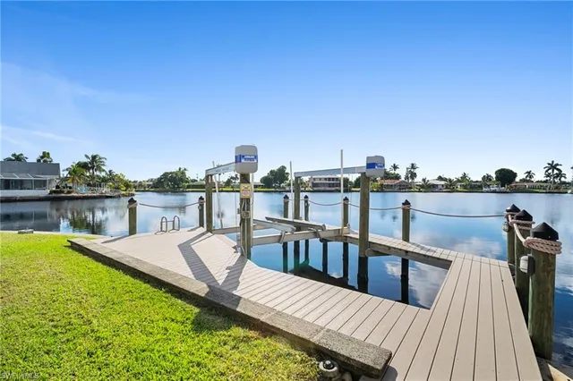 a view of a roof deck with furniture