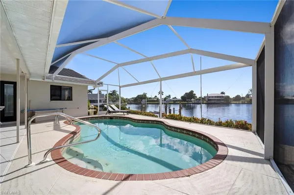 a view of a swimming pool with a patio