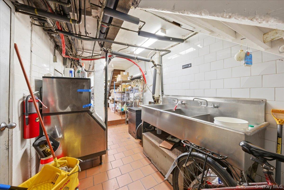 1435 2nd Avenue Manhattan, NY 10021 - Photo 17 of 33 a utility room with dryer and washer