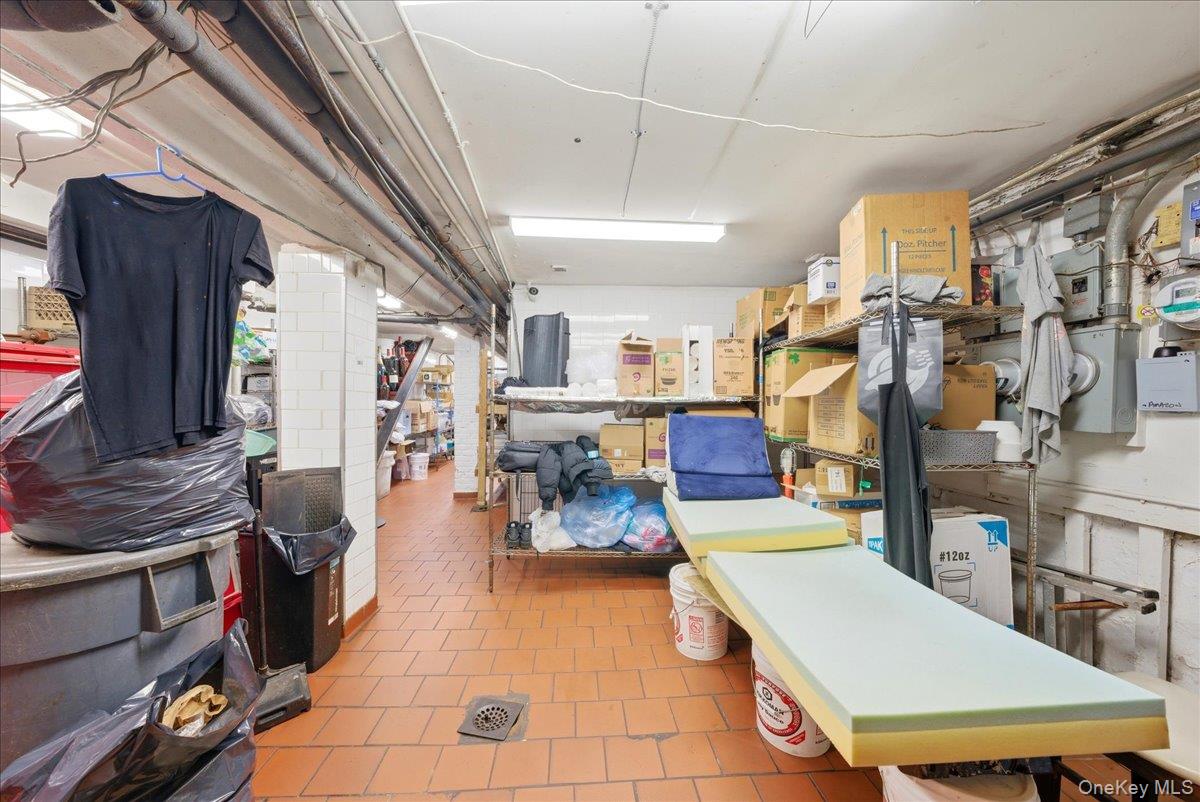 1435 2nd Avenue Manhattan, NY 10021 - Photo 18 of 33 a room with lots of furniture and clutter