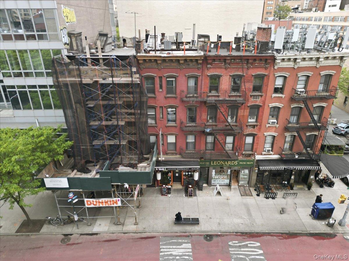 1435 2nd Avenue Manhattan, NY 10021 - Photo 30 of 33 a building with table and chairs