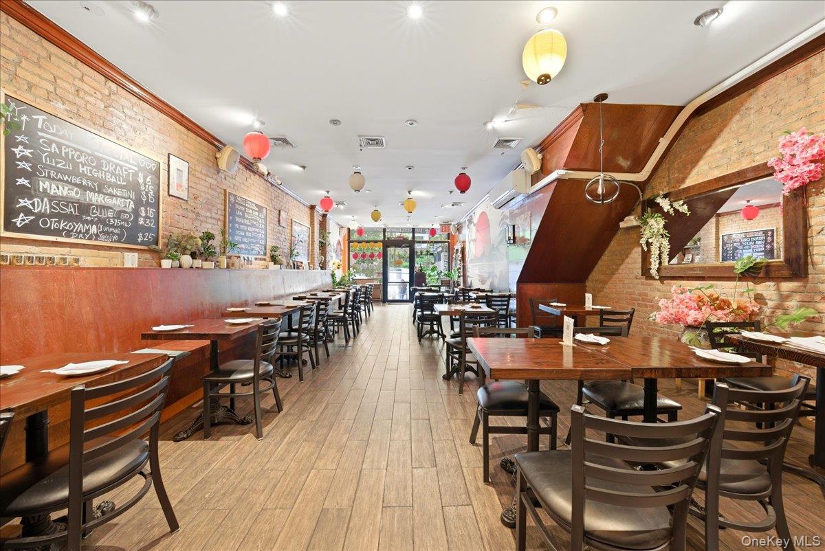 1435 2nd Avenue Manhattan, NY 10021 - Photo 6 of 33 a view of a dining room with furniture and wooden floor