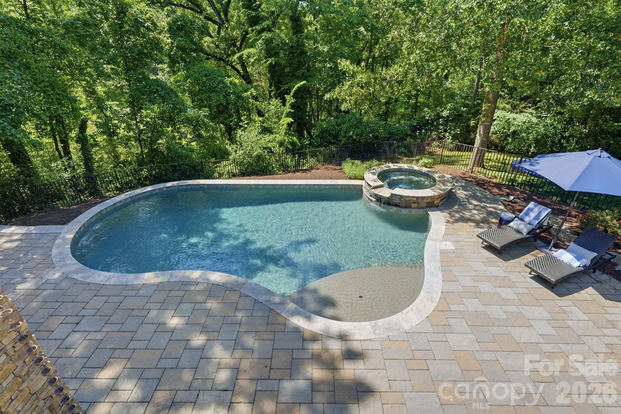 235 Grey Road Davidson, NC 28036 - Photo 36 of 42 a view of a swimming pool and lounge chair