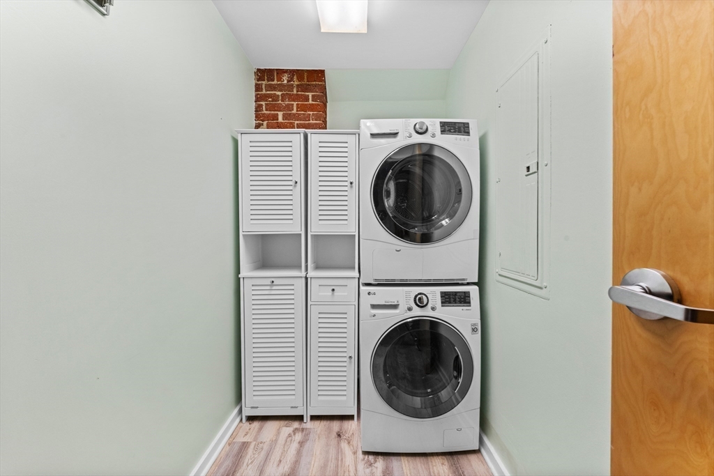 1 Envelope Terrace, Unit 110 Worcester, MA 01604 - Photo 11 of 15 a view of a hallway with washer and dryer