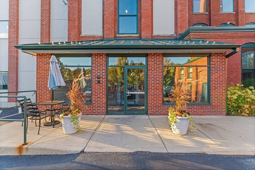1 Envelope Terrace, Unit 110 Worcester, MA 01604 - Photo 12 of 15 a front view of a building with glass windows