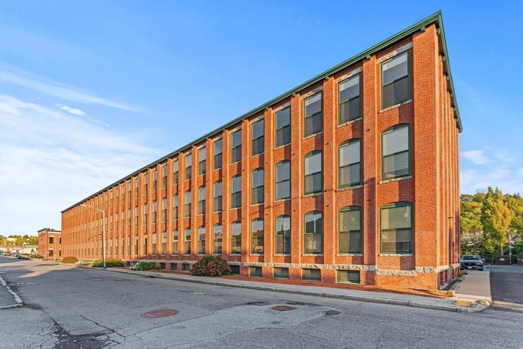 1 Envelope Terrace, Unit 110 Worcester, MA 01604 - Photo 13 of 15 a large building with a window and a door