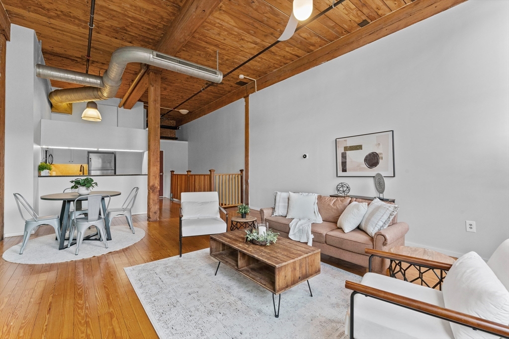 1 Envelope Terrace, Unit 110 Worcester, MA 01604 - Photo 2 of 15 a living room with furniture and wooden floor