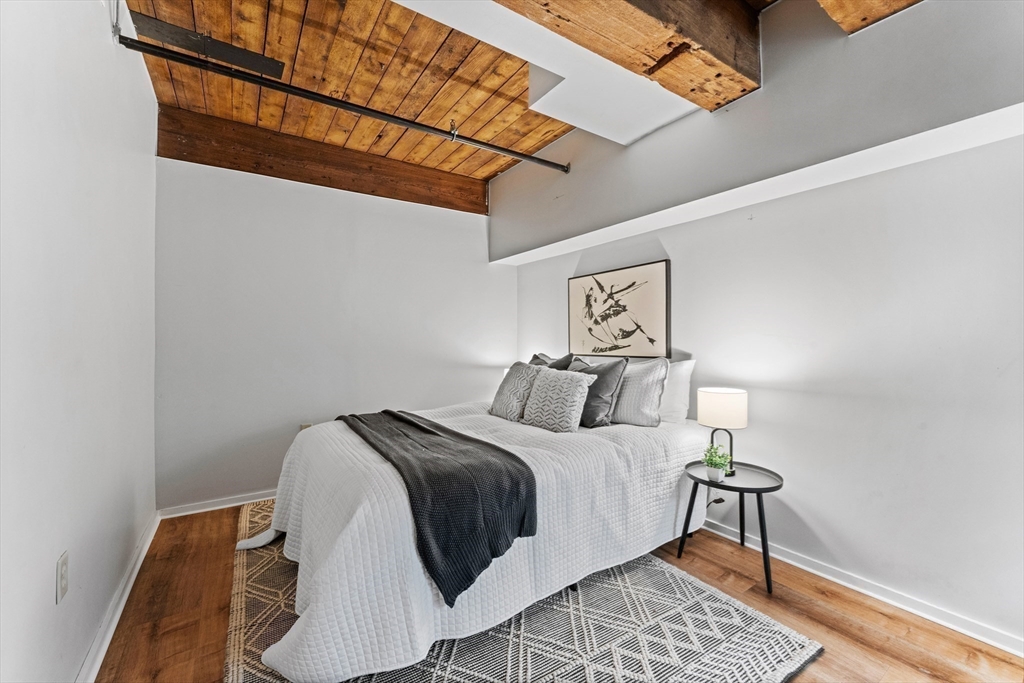 1 Envelope Terrace, Unit 110 Worcester, MA 01604 - Photo 10 of 15 a bedroom with a bed and a table