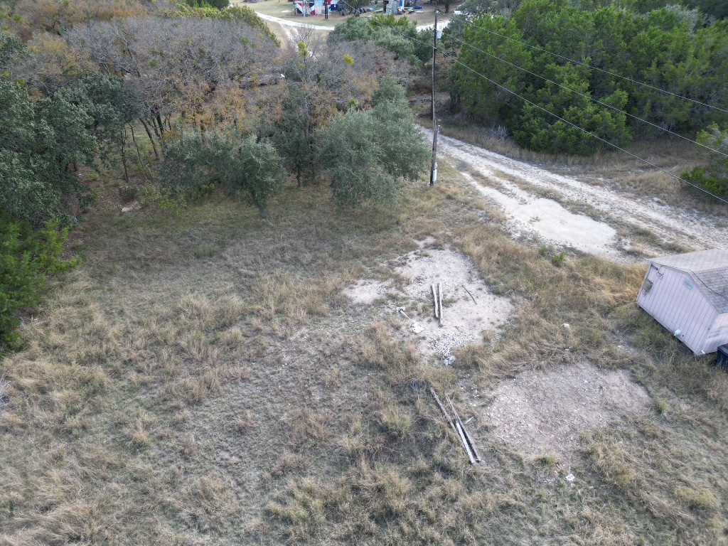 20940 Firefly Road Florence, TX 76527 - Photo 13 of 21 a view of a dry yard with wooden fence