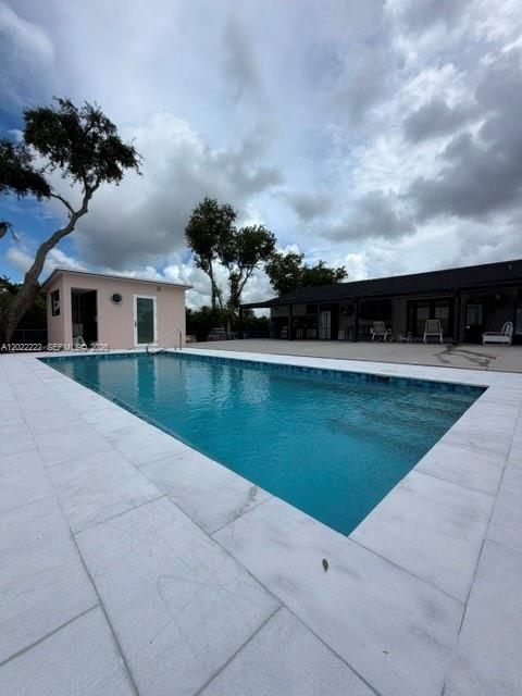 20465 Southwest 200th Street Miami, FL 33187 - Photo 9 of 36 a view of house with swimming pool and yard