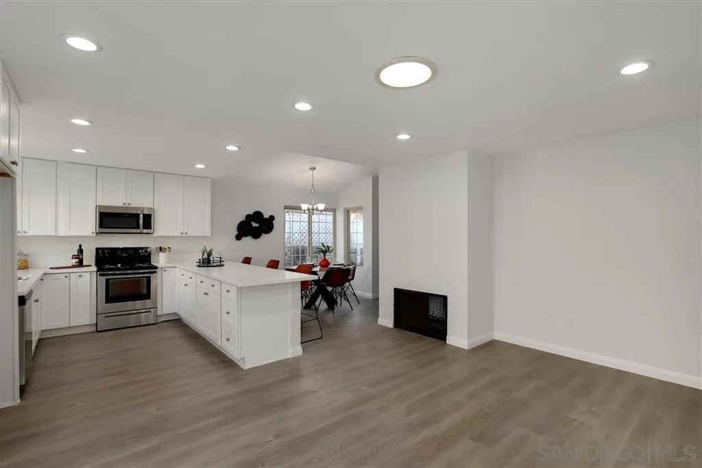 439 Mainsail Road Oceanside, CA 92054 - Photo 15 of 25 a view of kitchen with microwave stove refrigerator and cabinets
