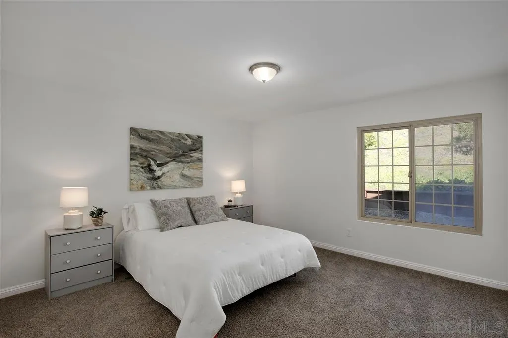 439 Mainsail Road Oceanside, CA 92054 - Photo 17 of 25 a bedroom with a bed and a window