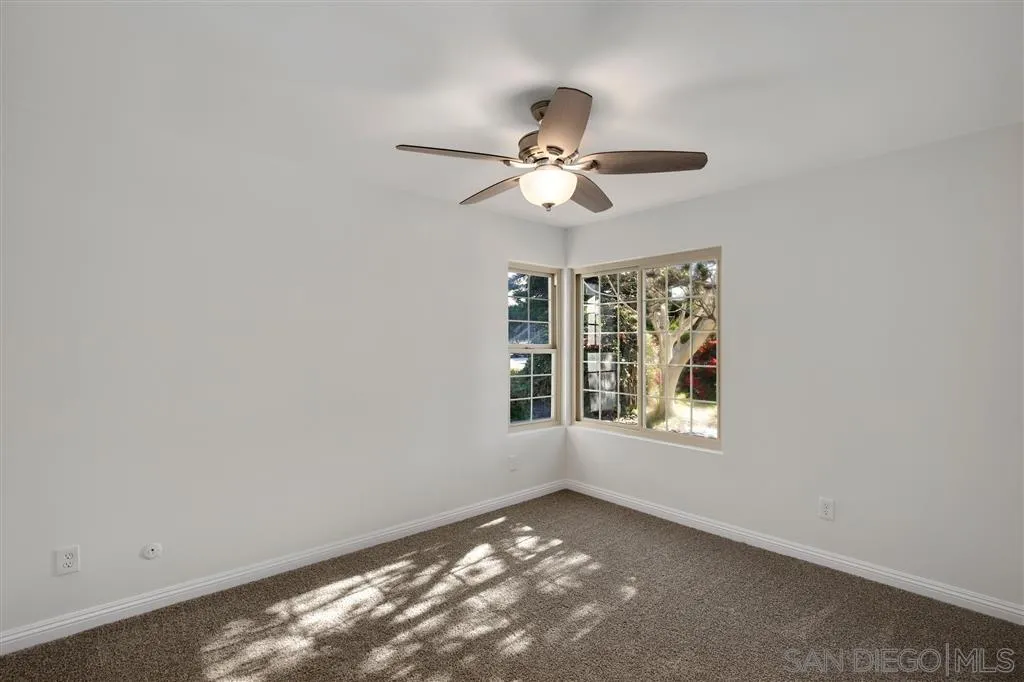 439 Mainsail Road Oceanside, CA 92054 - Photo 20 of 25 an empty room with a window and a fan