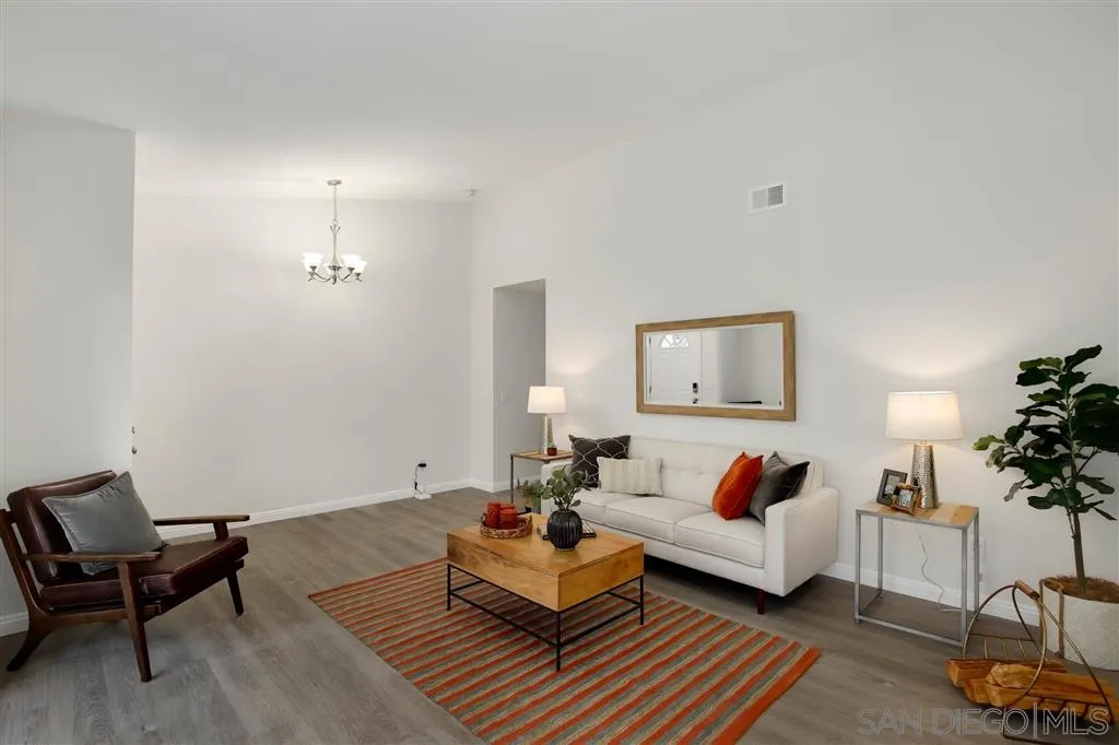 439 Mainsail Road Oceanside, CA 92054 - Photo 4 of 25 a living room with furniture and a potted plant